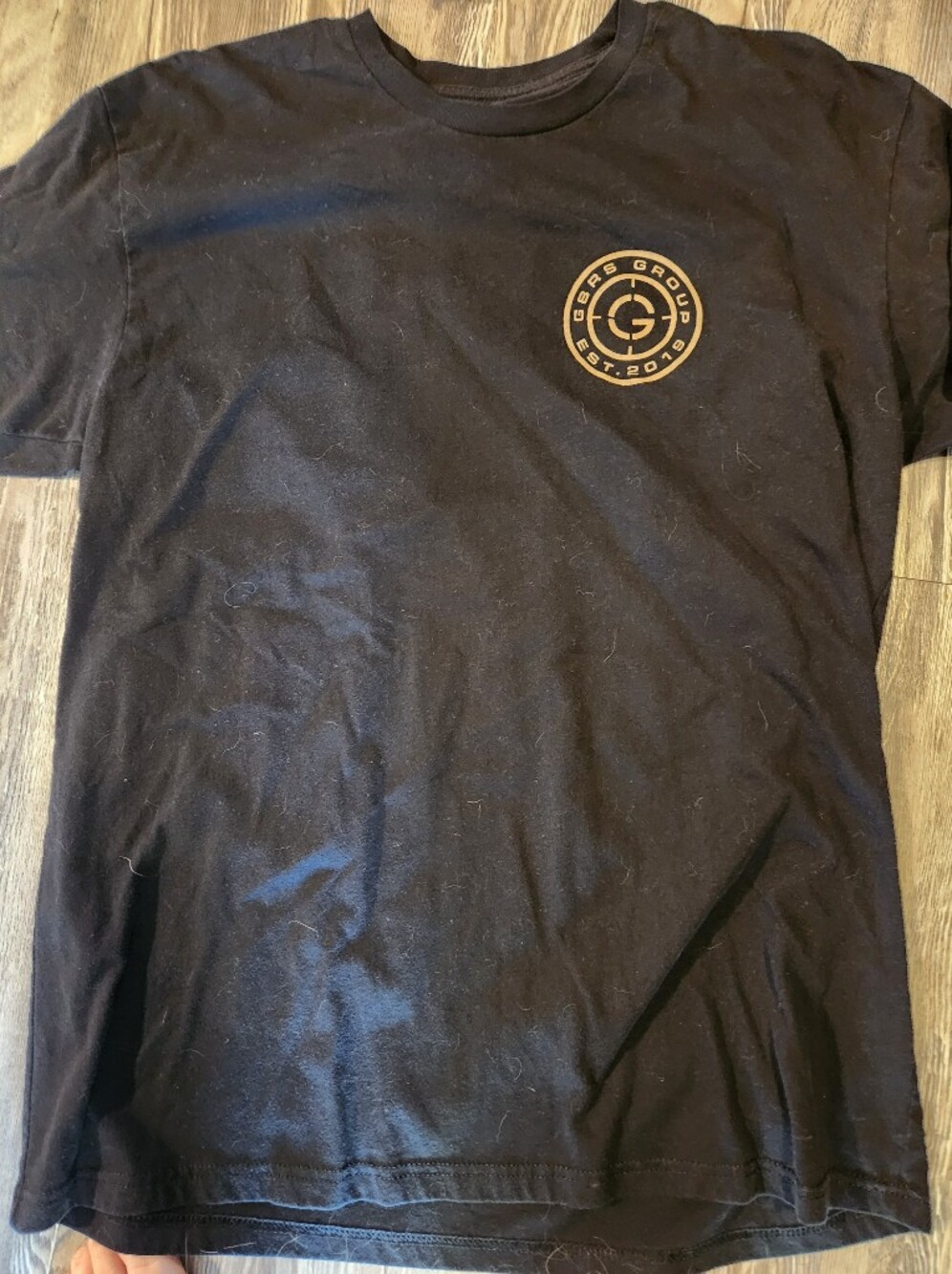 Black Graphic T-Shirt with Small Circular Logo